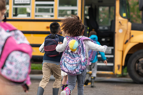 Students Running to School Bus